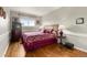Cozy bedroom featuring a wood frame bed with ornate bedding and hardwood floors at 1851 E 138Th Ave, Brighton, CO 80602