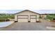 This detached oversized two car garage has a concrete driveway and two overhead doors at 1851 E 138Th Ave, Brighton, CO 80602