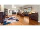 Open-concept living room with hardwood floors, large windows, and ample seating, perfect for gatherings at 1851 E 138Th Ave, Brighton, CO 80602