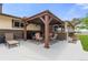 Covered patio area with outdoor furniture, grill and views of the backyard at 1851 E 138Th Ave, Brighton, CO 80602
