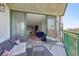 Balcony with a hanging chair and city views at 550 E 12Th Ave # 810, Denver, CO 80203