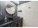 Bathroom with a black vessel sink and wall mirror at 550 E 12Th Ave # 810, Denver, CO 80203