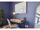 A cozy bedroom desk featuring a lamp, decor and a plant at 550 E 12Th Ave # 810, Denver, CO 80203