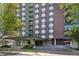 Exterior facade of building with covered entrance and landscaping at 550 E 12Th Ave # 810, Denver, CO 80203