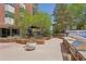 Beautiful courtyard featuring a built in outdoor grill, stone walls, gazebo, and lush greenery, perfect for entertaining at 550 E 12Th Ave # 810, Denver, CO 80203