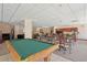 Spacious game room with a pool table, lounge area, and kitchenette, creating a relaxing space for entertainment at 550 E 12Th Ave # 810, Denver, CO 80203