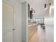 Hallway view featuring the kitchen and open floorplan in a modern condo at 550 E 12Th Ave # 810, Denver, CO 80203