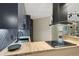 Bright kitchen with wood countertops and sleek appliances at 550 E 12Th Ave # 810, Denver, CO 80203