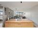 Bright open floorplan featuring a kitchen island, bookcase, and large windows offering city views at 550 E 12Th Ave # 810, Denver, CO 80203