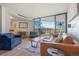 Inviting living room with balcony access offering city views at 550 E 12Th Ave # 810, Denver, CO 80203