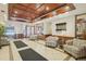 A bright lobby area featuring decorative chairs, mirrors, and a decorative wood ceiling at 550 E 12Th Ave # 810, Denver, CO 80203