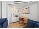 A modern office area featuring white cabinets and blonde wood desk at 550 E 12Th Ave # 810, Denver, CO 80203