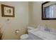 Cozy bathroom featuring a marble countertop sink, soft lighting, and elegant wall decor at 562 W Crestline Cir # 7D, Littleton, CO 80120