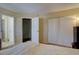 A bedroom featuring closet and bathroom access, bathed in natural light at 562 W Crestline Cir # 7D, Littleton, CO 80120