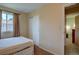 Bedroom features closet and natural light from a window at 562 W Crestline Cir # 7D, Littleton, CO 80120