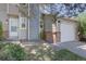 Charming home with a one car garage, brick accents and a well-kept front lawn at 562 W Crestline Cir # 7D, Littleton, CO 80120