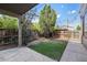 Cozy backyard with an artificial turf area, landscaped with trees, fenced for privacy at 1233 S Yosemite Way # 74, Denver, CO 80247