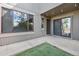 A cozy backyard area with concrete patio, artificial turf, and easy access to the house at 1233 S Yosemite Way # 74, Denver, CO 80247