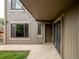 The backyard patio features string lights and easy access from sliding glass door at 1233 S Yosemite Way # 74, Denver, CO 80247