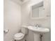 Clean bathroom with a pedestal sink and white fixtures offers a minimalist design at 1233 S Yosemite Way # 74, Denver, CO 80247