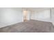 Large bedroom with wall closets and light-colored carpeting at 1233 S Yosemite Way # 74, Denver, CO 80247