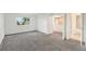 Inviting bedroom with a view to the bathroom and a bright window at 1233 S Yosemite Way # 74, Denver, CO 80247