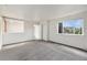 Bright and airy bedroom featuring a large window offering natural light at 1233 S Yosemite Way # 74, Denver, CO 80247