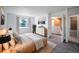 Stylishly furnished bedroom with a bed, dresser, and a window that brings in natural light at 1233 S Yosemite Way # 74, Denver, CO 80247
