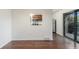 Dining room featuring hardwood floors and a pass-through to the kitchen at 1233 S Yosemite Way # 74, Denver, CO 80247