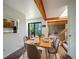 Cozy dining room with natural light, wood beams and hardwood floors at 1233 S Yosemite Way # 74, Denver, CO 80247