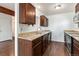 Well-equipped kitchen featuring stainless steel appliances and dark wood cabinets at 1233 S Yosemite Way # 74, Denver, CO 80247