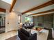Comfortable living room with modern decor, brick fireplace, and wood beam ceiling at 1233 S Yosemite Way # 74, Denver, CO 80247