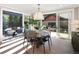 Dining Room showcasing a round table and chairs with large sliding doors to the outdoor entertaining area at 711 S Gaylord St, Denver, CO 80209