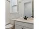 Bathroom features white tile, quartz countertops, and modern black hardware at 11487 E Briarwood Cir, Centennial, CO 80112