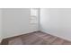This bedroom is freshly painted in white, has carpet and a view from the window at 11487 E Briarwood Cir, Centennial, CO 80112