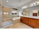 Bathroom featuring a shower, bathtub, and double sink vanity at 1706 Ghost Dance Cir, Castle Rock, CO 80108