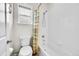 Bright bathroom with a tiled bathtub and a glass shower door at 1706 Ghost Dance Cir, Castle Rock, CO 80108