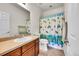 Cozy bathroom with turtle themed shower curtain, a vanity and a toilet at 1706 Ghost Dance Cir, Castle Rock, CO 80108