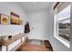 Welcoming foyer with hardwood floors, a console table, coat rack, and natural light from a window at 1706 Ghost Dance Cir, Castle Rock, CO 80108