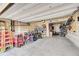 Spacious two-car garage featuring ample storage space for bikes and tools at 1706 Ghost Dance Cir, Castle Rock, CO 80108