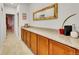 Hallway with built in cabinets, stone countertops and a modern mirror at 1706 Ghost Dance Cir, Castle Rock, CO 80108