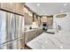 Spacious kitchen featuring stainless steel appliances and large marble island at 1706 Ghost Dance Cir, Castle Rock, CO 80108