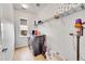 Well-organized laundry room with modern washer and dryer at 1706 Ghost Dance Cir, Castle Rock, CO 80108