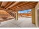 Backyard patio with concrete paving, retaining wall and steps to the backyard at 1706 Ghost Dance Cir, Castle Rock, CO 80108