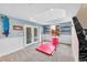 Bright playroom with carpet floors, a gymnastics mat, and French doors to backyard at 1706 Ghost Dance Cir, Castle Rock, CO 80108