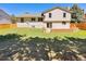 Backyard showcasing a brick patio and a fenced-in lawn at 16750 E Ada Pl, Aurora, CO 80017