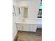 Bathroom featuring bright natural light, modern vanity and a large mirror at 16750 E Ada Pl, Aurora, CO 80017