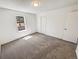 Bedroom featuring carpet, window, and closet at 16750 E Ada Pl, Aurora, CO 80017
