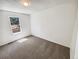 Bedroom featuring neutral walls and carpet with a window overlooking the neighborhood at 16750 E Ada Pl, Aurora, CO 80017