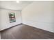 Bedroom featuring neutral walls and carpet with a window overlooking the neighborhood at 16750 E Ada Pl, Aurora, CO 80017